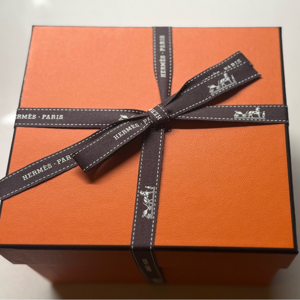 Hermès Vibrant Orange Box with Black Accents.